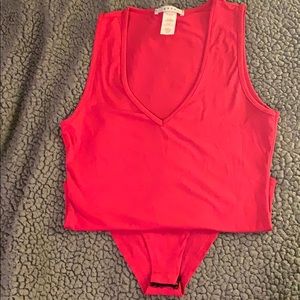 Red sleeveless v-neck bodysuit